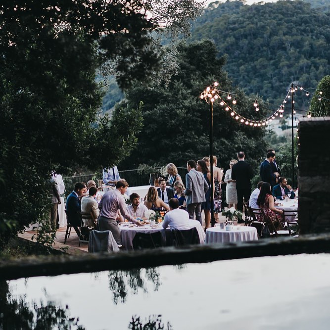 A group of people at a wedding reception sat at dinner tables in Spain A group of people at a wedding reception sat at dinner tables in Spain
