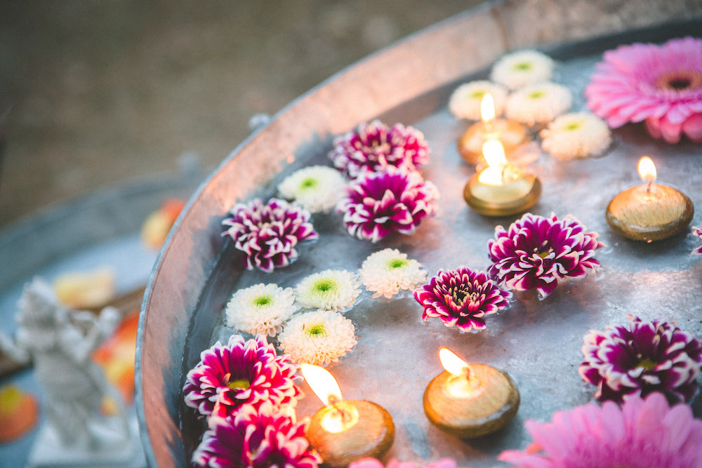 Flowers in water décor at an interfaith wedding ceremony Flowers in water décor at an interfaith wedding ceremony
