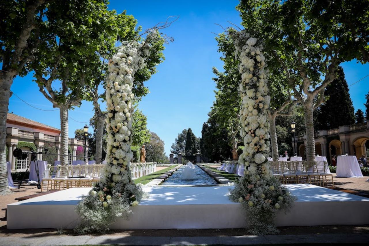The courtyard of a Spanish mansion decorated with flower garlands