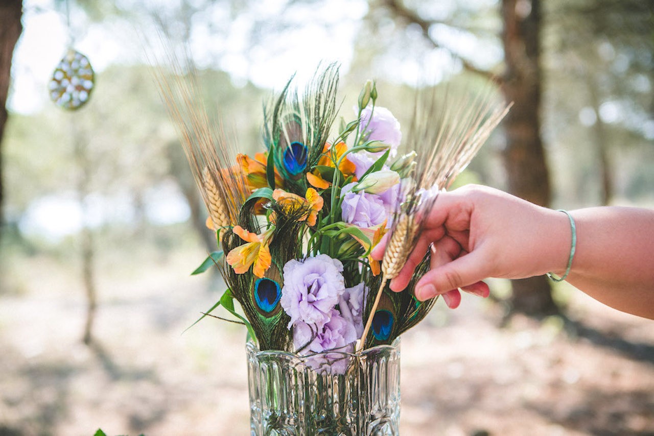 A wedding planner adjusting beautiful wedding flowers A wedding planner adjusting beautiful wedding flowers