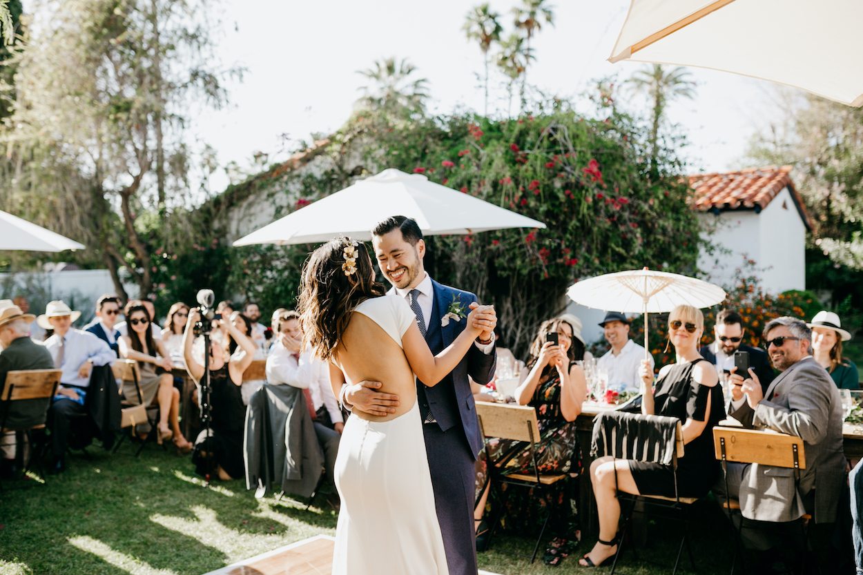 A couple dancing together on their wedding day