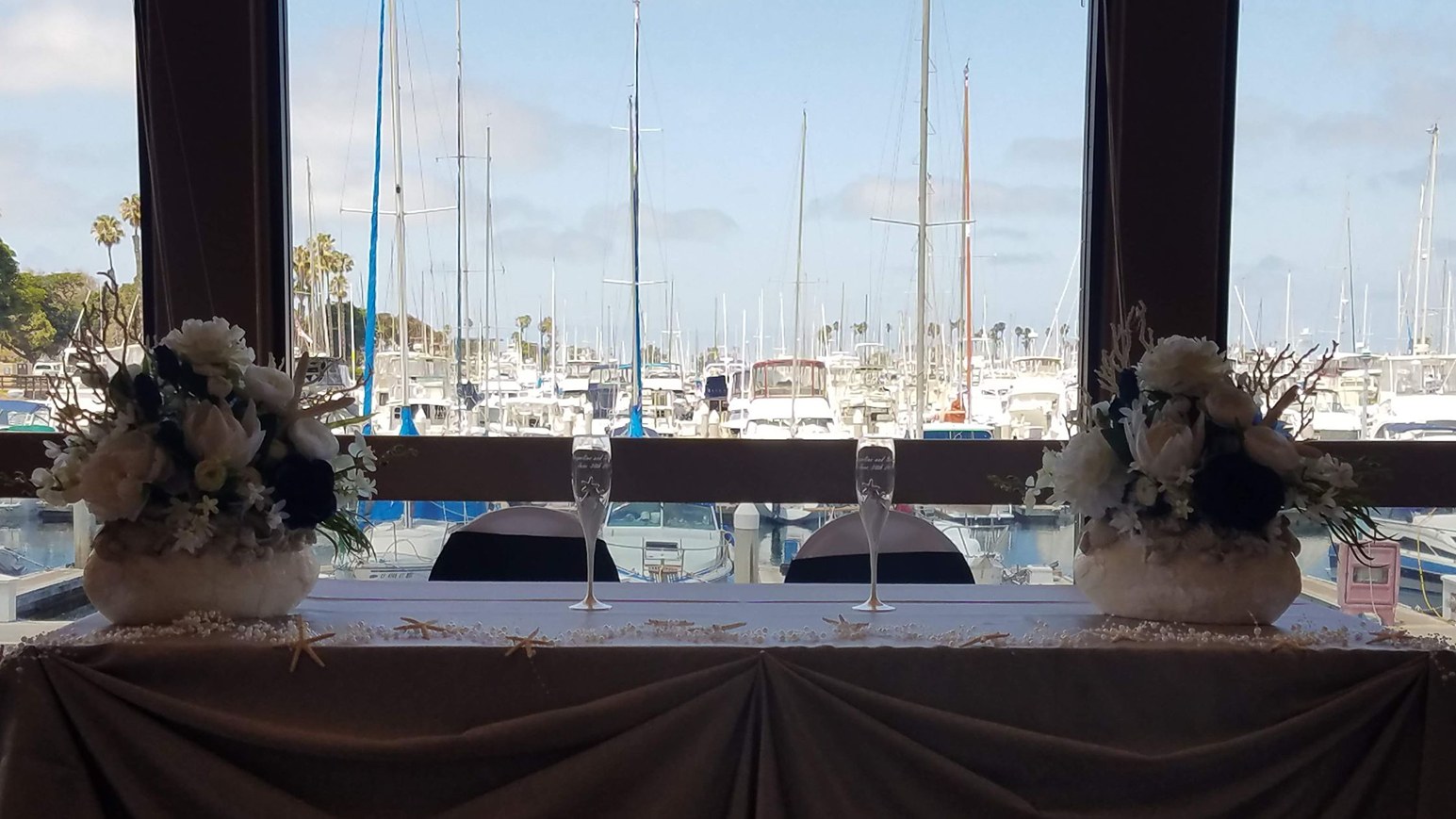 A tie on a mirrored table Yacht wedding reception table